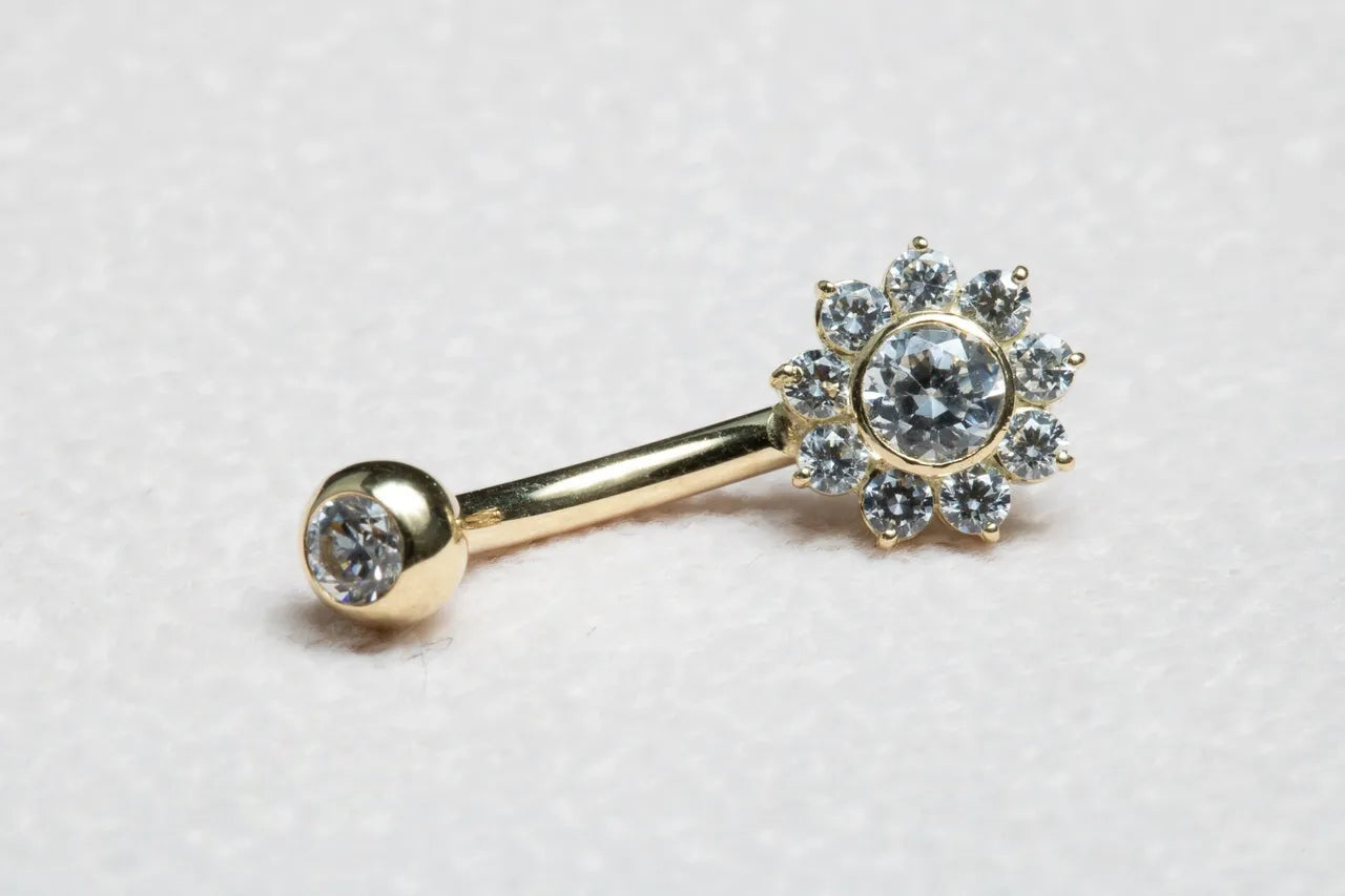 Piercing umbigo dourado flower